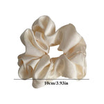 Soft, elastic hair scrunchie, perfect for holding hair securely without causing damage, suitable for all hair types.