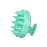 Silicone shampoo brush with ergonomic handle for gentle scalp cleansing and exfoliation